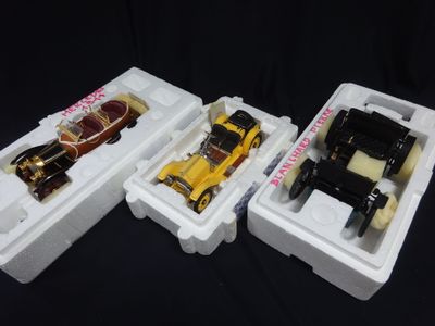 three plastic containers with toy cars in them on a black background