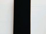 an image of a black speaker sitting on top of a white table