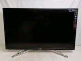 a close up of a flat screen tv sitting on a white surface