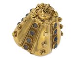 an image of a ladybug ring with blue stones on a white background