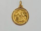 a close up of a gold coin with a horse and rider on it