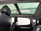 a view of the sunroof from inside of a car