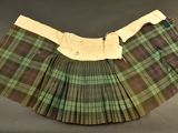 a close up of a skirt on a table with a black background