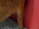 a cat that is sitting on top of a wooden table