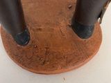 a small piece of copper sitting on top of a table