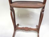 an image of a small wooden table with a mirror on top of it