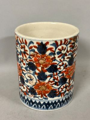 a cup with a floral design on it