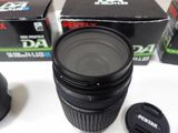 a camera lens sitting on top of a table next to a box