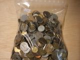 a bag full of coins sitting on a table
