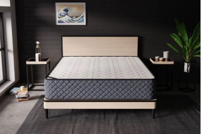 a mattress that is sitting on a bed in a room
