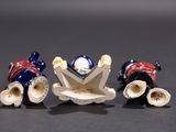 three figurines that are sitting on a table