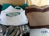 a box of clothing and a pillow on a table