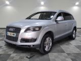 an image of a silver suv parked in a garage