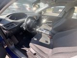 the interior of a car with a steering wheel and a dashboard