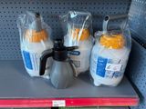 three bags of milk and a jug of milk on the shelf