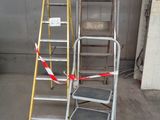 two ladders that are next to each other in a garage