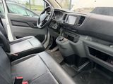 the interior of a car with a steering wheel and dashboard controls