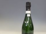 a bottle of champagne sitting on a counter top