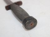 a small knife that is laying on a table