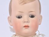 a small doll that is sitting on a table