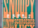un livre avec une couverture verte et des lettres orange