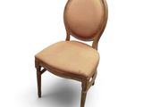 an image of a wooden chair with a beige upholstered seat