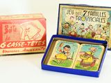 two boxes of cigarettes and a box of matches on a white surface