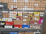 a metal rack with many boxes on top of it