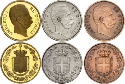 a close up of a group of coins with different faces