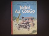 a book with a picture of a giraffe and people in a car