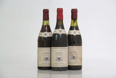 three bottles of wine sitting next to each other on a table