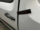 a sticker on the door of a car that says vato
