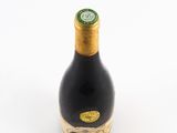 a bottle of wine that is sitting on a table