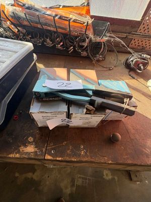 a table with a box of books and a mattress on it