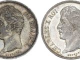 a silver coin with an image of a woman ' s head on it