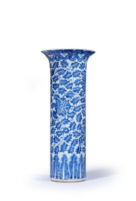 blue and white vase with a floral design on a white background