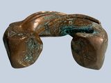 a bronze sculpture of a hand with a glove on it
