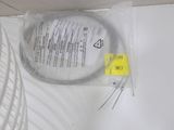 a plastic container with a wire on it sitting on a counter