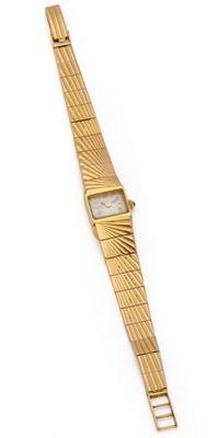 a close up of a wrist watch on a white surface