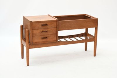 an image of a wooden table with drawers and a shelf