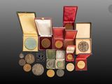 many different types of coins in a red box