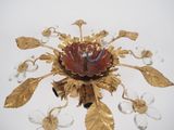 a gold flower with a blue ring on it