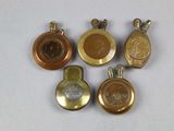 four different types of gold and silver lockes on a white surface