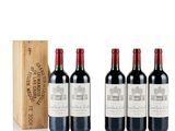 four bottles of red wine and a wooden box