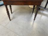 a small table with a wooden top and legs