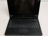 a black laptop computer sitting on a white surface