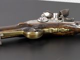 an old gun that is sitting on top of a table