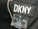 a close up of a label on the back of a black shirt
