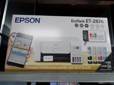 une boîte contenant une imprimante et un téléphone portable