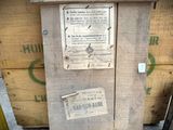 a wooden box that has a sign on it
